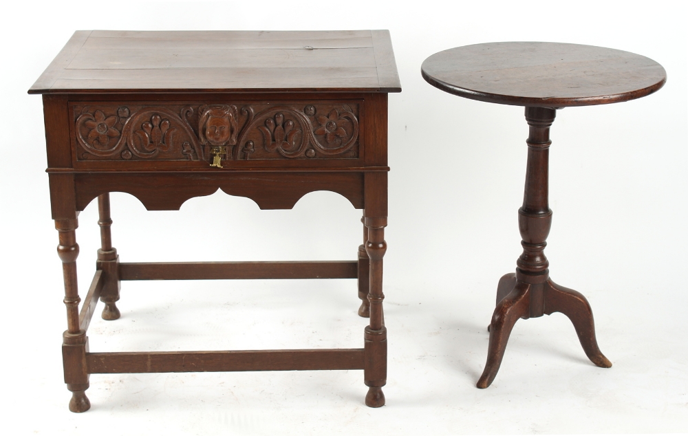 Property of a gentleman - a carved oak side table, the frieze drawer with mask decoration, 28.75ins.