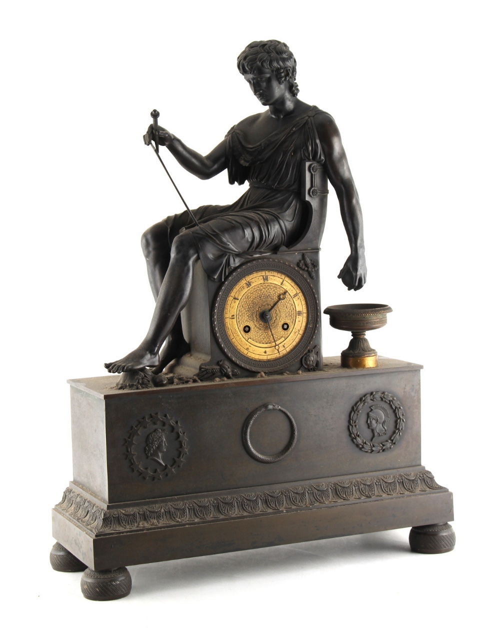 Property of a lady - a French patinated bronze mantel clock, second quarter 19th century, surmounted