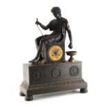 Property of a lady - a French patinated bronze mantel clock, second quarter 19th century, surmounted