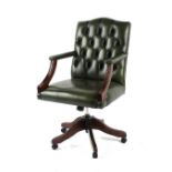 Property of a lady - a reproduction green button upholstered desk chair.