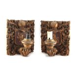 Property of a lady - a pair of early 20th century carved giltwood wall lights or appliques, each