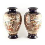 Property of a gentleman - a pair of early 20th century Japanese Satsuma vases, each painted with