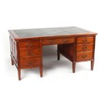 Property of a lady - an Edwardian mahogany desk with leather inset top above seven drawers & two