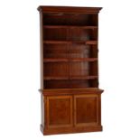 Property of a lady - a late Victorian oak two-part bookcase, with bevelled glass panelled doors