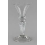 Property of a lady - an early 18th century drinking glass with bell shaped bowl above a six sided