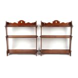 Property of a lady - a pair of late Victorian walnut graduated three-tier wallshelves, each