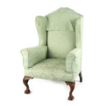 Property of a deceased estate - a George III style mahogany & green upholstered wing armchair,