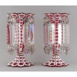 Property of a lady - a pair of late 19th century overlaid ruby glass table lustres, 9ins. (23cms.)