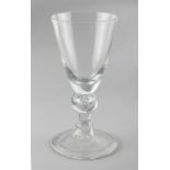 Property of a deceased estate - a very large heavy baluster wine glass, 18th / 19th century, with