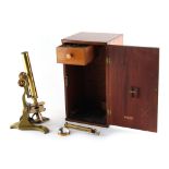 Property of a lady - an early 20th century lacquered brass & painted microscope, in mahogany case