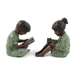Property of a deceased estate - two painted bronze figures of a seated girl & boy reading, the
