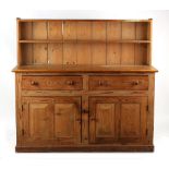 Property of a deceased estate - a pine dresser, with low rack, 60ins. (152.5cms.) long.