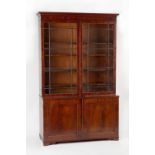 Property of a lady - an early 19th century George IV mahogany two-part bookcase, enclosing