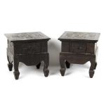 Property of a deceased estate - a pair of carved ebonised wood low tables, each fitted with a