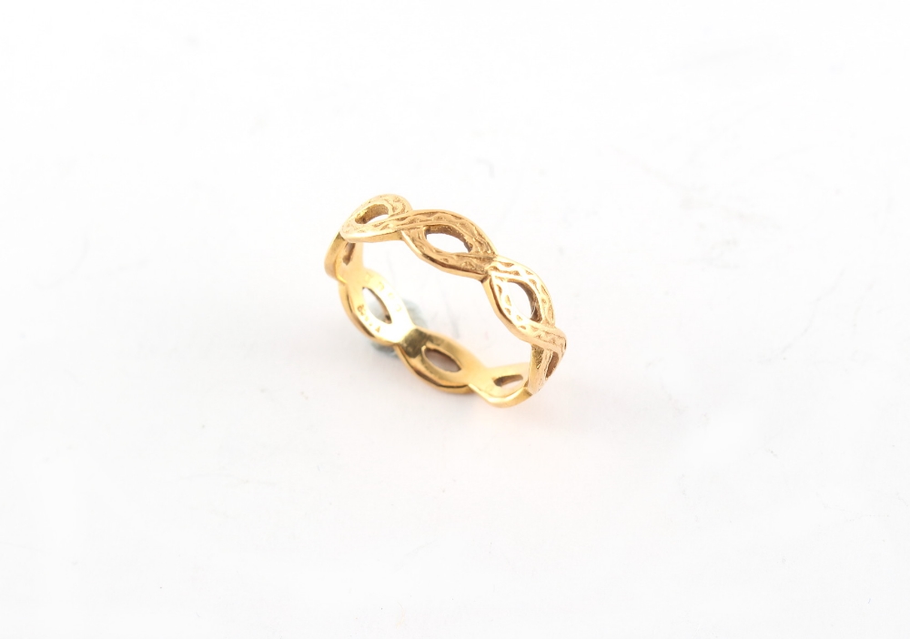 Property of a lady - a 22ct yellow gold wedding band or ring, of Celtic design, Birmingham 1979,