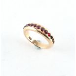 Property of a deceased estate - a 9ct gold ring set with red stones, probably garnets, three of the