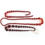 Property of a lady - three cherry amber type necklaces, approximately 150 grams together (3).