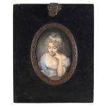 Property of a lady - a 19th century portrait miniature on ivory depicting a young lady reading a