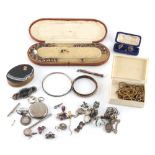 Property of a lady - a bag containing assorted jewellery including a silver coin bracelet, a leather