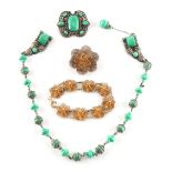 Property of a lady - a green stone necklace; together with a similar brooch; a filigree bracelet;