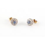 Property of a lady - a pair of unmarked yellow gold diamond & sapphire cluster earrings, with post &