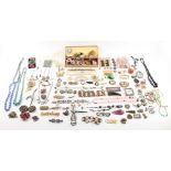 Property of a lady - a box containing costume jewellery including a large mother-of-pearl