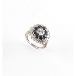 Property of a lady - an 18ct white gold sapphire & diamond cluster ring, the estimated total diamond