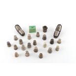 Property of a lady - a collection of twenty silver thimbles, one with 14ct gold collar, three in