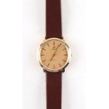 Property of a gentleman - a gentleman's Omega De Ville 9ct gold cased wristwatch, on brown leather