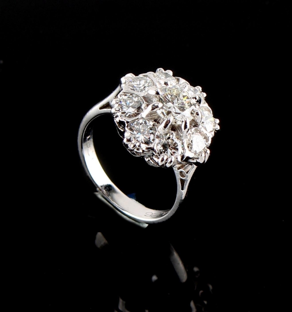 Property of a lady - a good 18ct white gold diamond cluster ring, with nine round brilliant cut