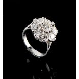 Property of a lady - a good 18ct white gold diamond cluster ring, with nine round brilliant cut