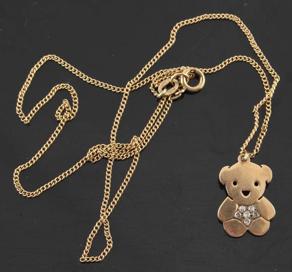 Property of a deceased estate - a 9ct gold teddy bear pendant set with six small round cut diamonds,