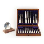 Property of a lady - an oak canteen containing a set of silver plated dessert knives & forks with