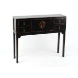 Property of a deceased estate - a Chinese style ebonised side table with two doors flanked by four