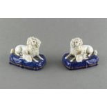 Property of a lady - a pair of 19th century Samson of Paris porcelain models of recumbent dogs