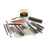 Property of a lady - a box containing assorted pens, etc., including two Parker 51 fountain pens (