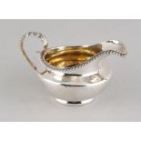 Property of a deceased estate - a George IV silver milk jug with gilt interior, Rebecca Emes &