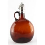 Property of a lady - a Victorian silver topped amber glass wine jug, London 1858, the hinge