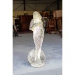 Property of a deceased estate - a well weathered reconstituted stone garden figure of Venus,