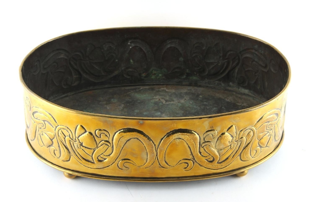 Property of a lady - an early 20th century Art Nouveau brass oval planter with embossed stylised