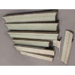 Property of a lady - a set of seven Edwardian pale blue painted pelmet sections, the longest