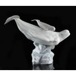 Property of a deceased estate - Lladro - a Beluga whale & calf, model number 8458, 17ins. (43cms.)