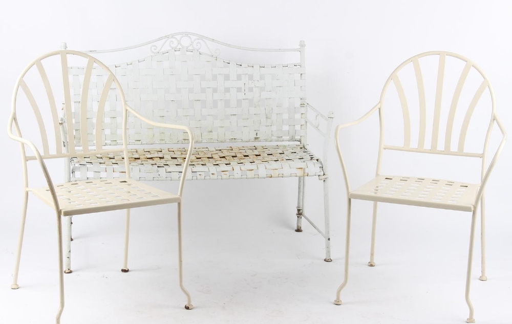 Property of a deceased estate - a white painted metal garden bench; together with a similar pair