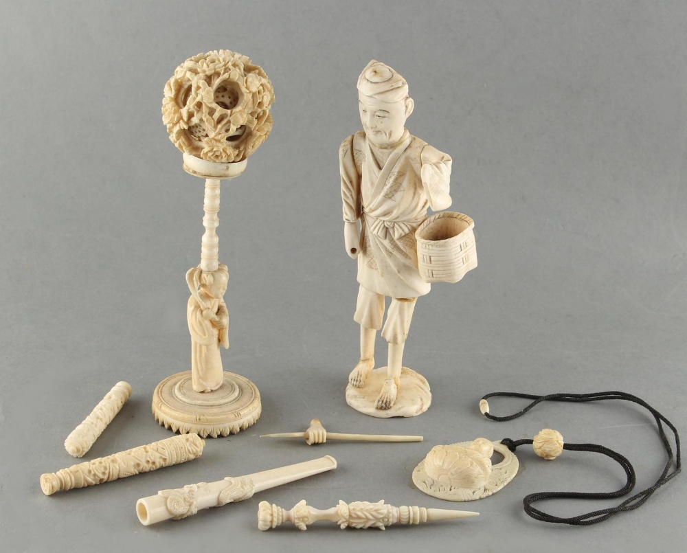 Property of a gentleman - a bag containing assorted Chinese, Japanese carved ivory & bone items