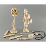 Property of a gentleman - a bag containing assorted Chinese, Japanese carved ivory & bone items