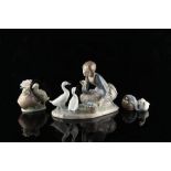 Property of a deceased estate - three Lladro figures with ducks, the largest 9ins. (23cms.) long (