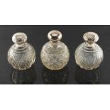 Property of a lady - a pair of Edwardian silver flip-top cut glass globe scent bottles, Birmingham