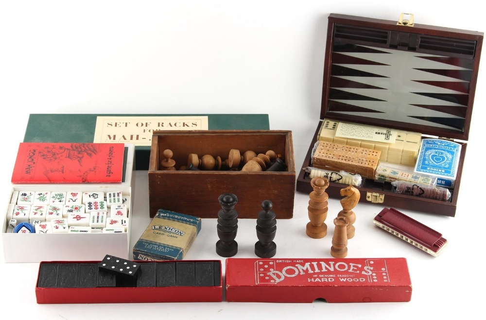 Property of a gentleman - a quantity of games including a turned wood chess set, one black knight