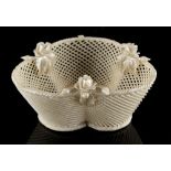 Property of a lady - a Belleek trefoil basket, strip or strap mark to base, 5.5ins. (14cms.) across.