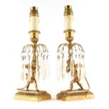 Property of a lady - a pair of late 19th century ormolu or gilt brass cherub table lustres,